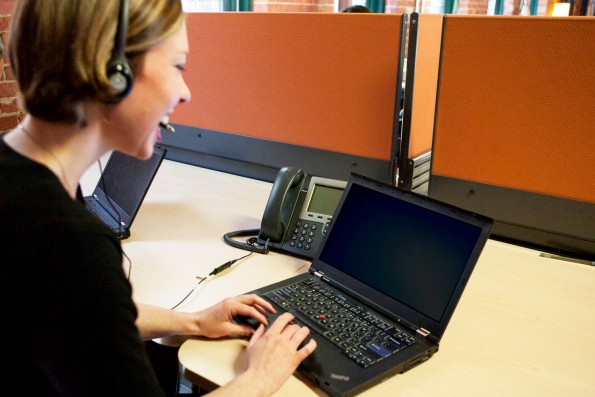 Girl On Phone Using Laptop